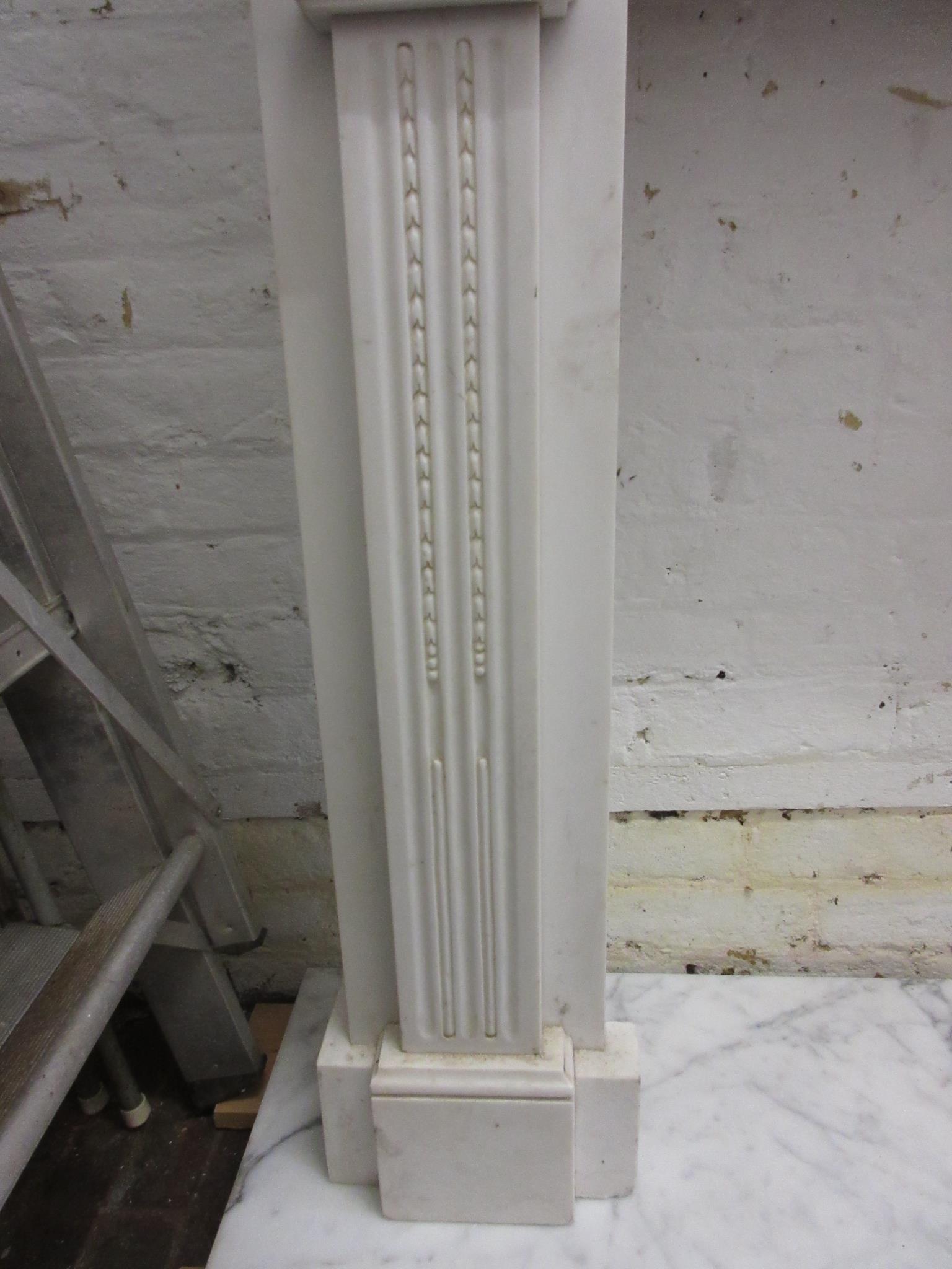 Large white marble fire surround having a moulded mantelpiece, above a central urn with bows and - Image 7 of 12