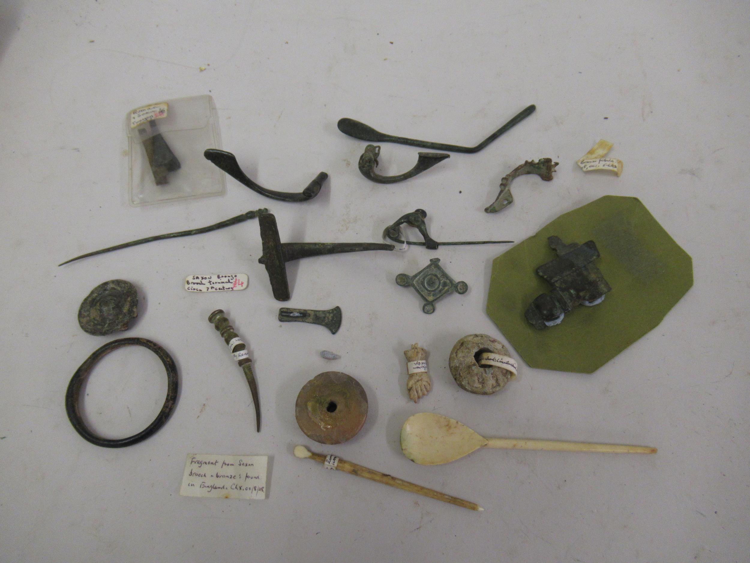 Collection of Roman and other ancient brooches, tweezers etc.