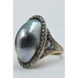Large antique ring set oval black Tahitian cultured pearl surrounded by diamond chips and similar