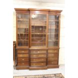 Early 19th Century mahogany breakfront bookcase, the moulded cornice above three astragal glazed