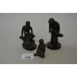 Small dark patinated bronze figure of a seated boy removing a thorn from his foot, 4.5ins high,