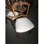 Set of six Victorian walnut drawing room chairs, the carved and pierced splat backs above cream