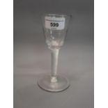 18th Century drinking glass, the faceted tapering bowl above an air twist stem and circular foot,