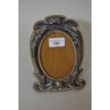 Early 20th Century Birmingham silver mounted floral embossed photograph frame, bearing the motto '