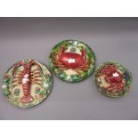Pair of 20th Century Continental Palissy type plates decorated with a lobster and crab, 11.5ins