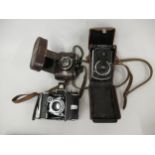 Rolleiflex, small format twin lens camera, Serial No. 523016, in original leather case together with