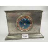 Liberty & Co. Tudric pewter mantel clock, the rectangular beaten case with a circular enamel and