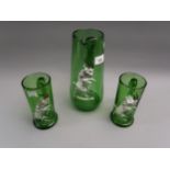 Continental green glass jug and two mugs, each relief moulded with rams