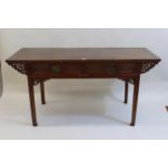 20th Century Chinese elm side table, the plank top above two carved frieze drawers, raised on square