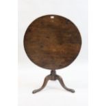 18th Century oak circular tilt top pedestal table, the bird cage base on a baluster turned support