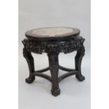 20th Century circular carved hardwood, marble inset low jardiniere stand, with shaped stretchers,