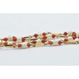 Middle Eastern yellow metal pearl and coral necklace, 21.5ins long
