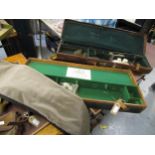 Antique brown leather brass mounted gun case with various cleaning rods, another canvas bound and