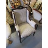 Edwardian mahogany and upholstered wing back armchair on cabriole front supports