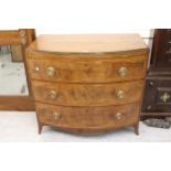 George III mahogany bow fronted chest, with brushing slide and three long drawers on splayed