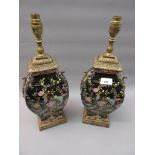 Pair of reproduction metal mounted pottery table lamps decorated with birds