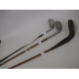 Early Hickory shafted weighted golf wood, together with two steel headed clubs Condition as shown in