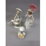 Two Lladro figures of young ladies with parasols and another small Lladro bust of a girl in