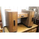 Art Deco oak and ebonised dressing table, having central shaped drawer, flanked by two doors on