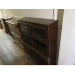 A Minty type three section bookcase with glazed and wooden panelled doors raised on bracket feet,