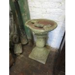 Weathered cast concrete garden bird bath, 23ins high (damages to the top)