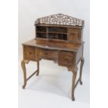 20th Century hardwood desk having super structure back with an arrangement of cupboards and