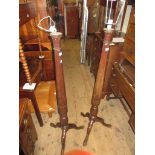 Pair of 20th Century mahogany fluted and carved column standard lamps on tripod bases, together with