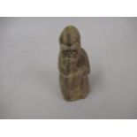 Carved inuit style stone figure of a kneeling bearded man, 4.5ins high