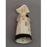 Royal Worcester candle snuffer in the form of a nun, puce mark 3.75''
