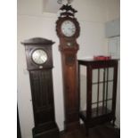 19th Century Continental oak longcase clock, the floral carved hood with a bar glazed pendulum