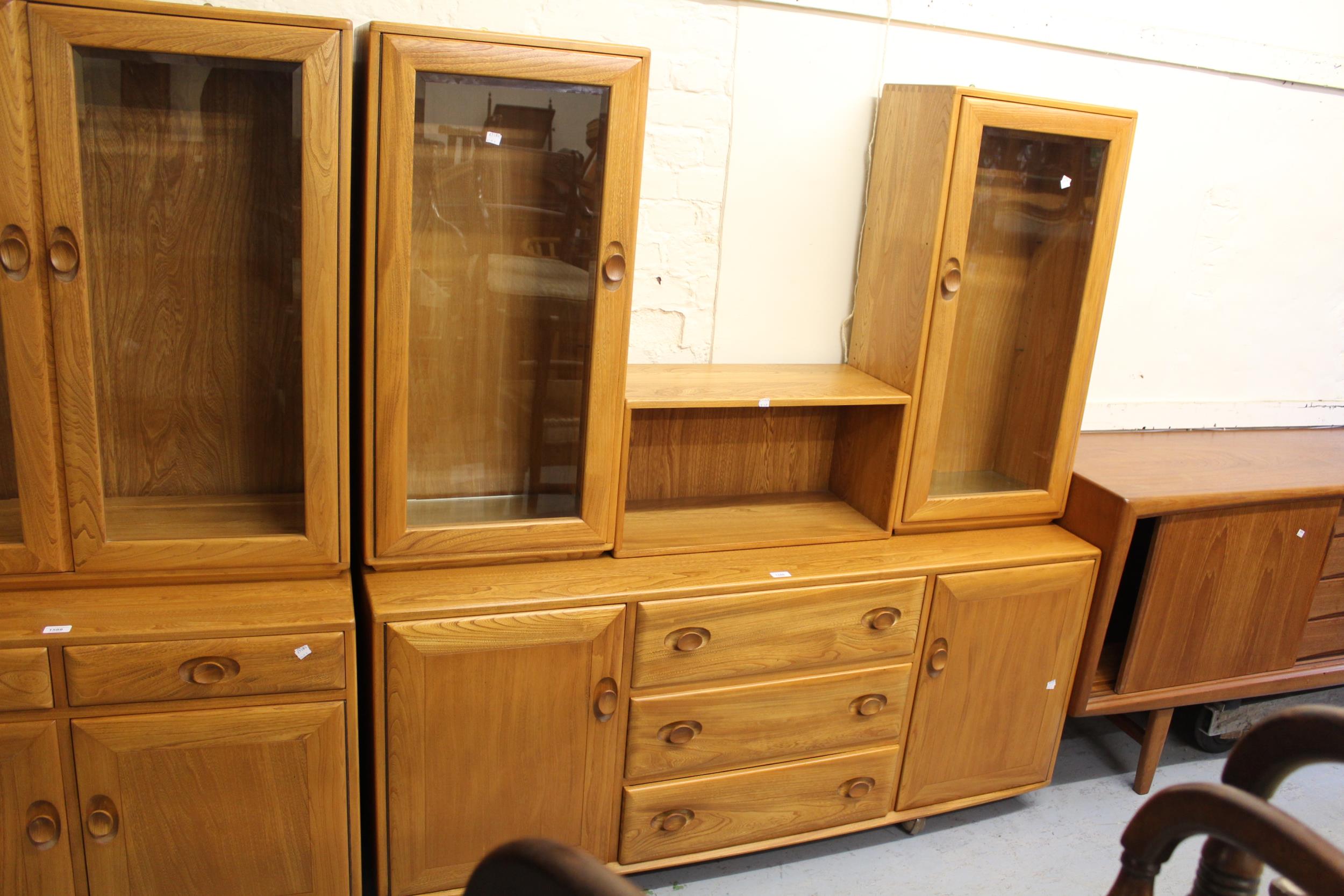 Modern Ercol side cabinet, the superstructure with two glazed cupboard doors enclosing adjustable