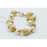 18ct Gold and cultured pearl alternating bead link bracelet, 7.75ins long, 13.5g gross A