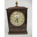 Regency mahogany and cut brass inlaid mantel timepiece, the circular painted dial with Roman