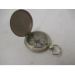 20th Century steel cased compass with silvered dial, inscribed Whittnauer, the outer case stamped