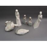 Two Lladro figures of swans, two small Lladro figures of girls and two Royal Doulton white glazed