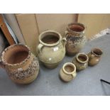 Six various terracotta baluster form jars