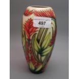 Moorcroft vase with typical stylised floral design on a cream ground, 2003, 7.25ins high, with