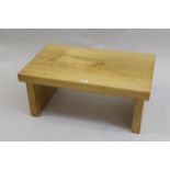 Modern sycamore coffee table with a plank top and block end supports, 29.5ins x 15.5ins together
