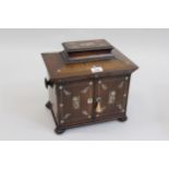 Early Victorian rosewood mother of pearl inlaid table cabinet, the sarcophagus shaped hinged cover