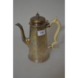 Victorian silver coffee pot in Georgian style, the plain tapering body engraved with swags and bows,