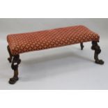 Large rectangular window seat raised on shell floral and claw front supports with carved cabriole