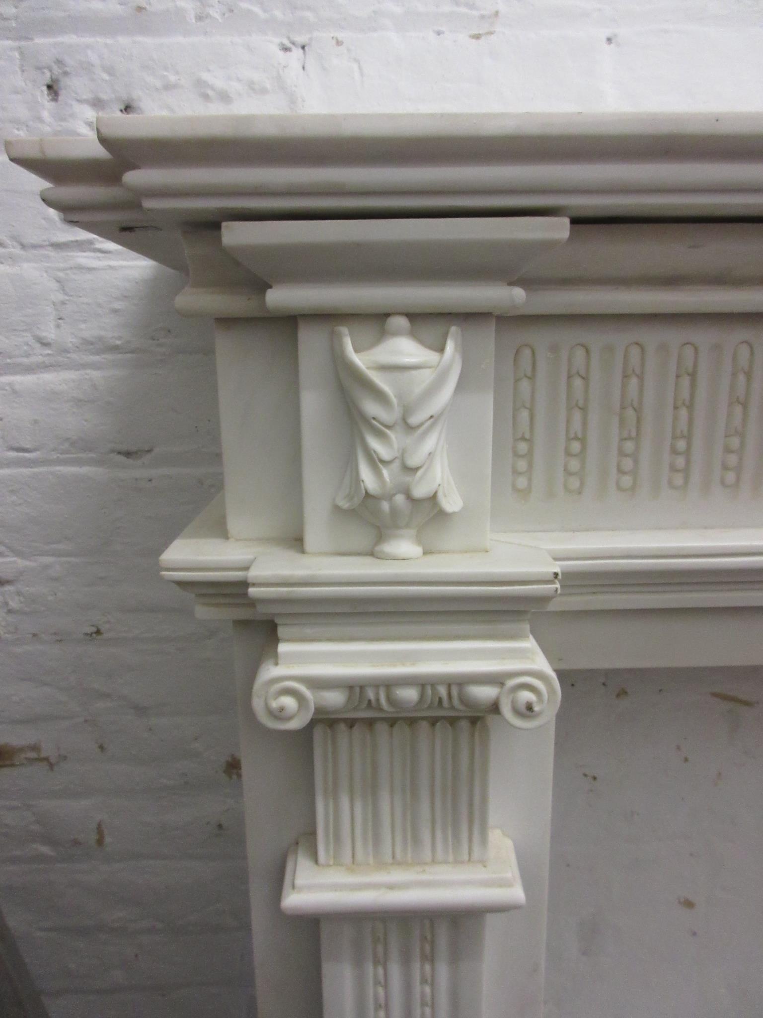 Large white marble fire surround having a moulded mantelpiece, above a central urn with bows and - Image 3 of 12