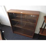 Mid 20th Century teak dwarf bookcase by Jonell with two glass sliding doors, 30ins wide x 9.5ins