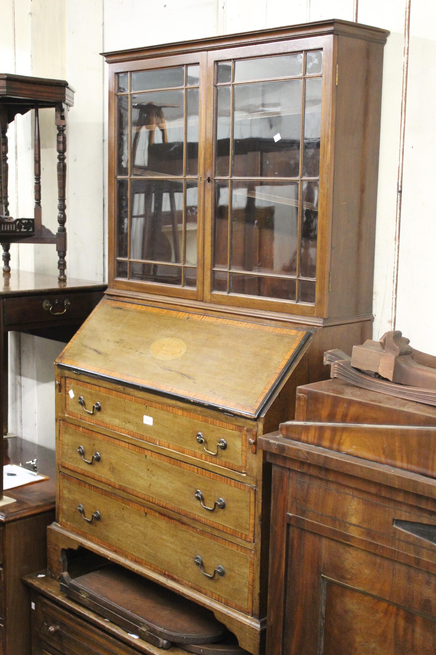 Edwardian mahogany and satinwood crossbanded bureau with an associated bookcase top, together with a