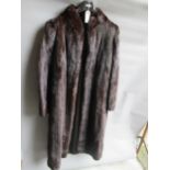 Ladies dark brown three quarter length mink fur coat together with a similar mid tan jacket