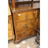 Mid 20th Century walnut chest of two short and two long drawers with brass drop handles raised on