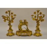 19th Century French gilt bronze and porcelain mounted three piece clock garniture, with circular