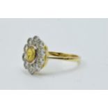 18ct Yellow gold ring set oval yellow sapphire surrounded by brilliant cut diamonds
