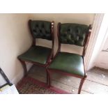 Pair of green leather button upholstered side chairs
