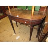 George III mahogany half round fold-over tea table on turned reeded supports